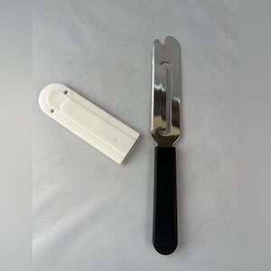 The Pampered Chef Stainless Steel Cheese Slicer with Black Handle